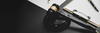 Black gavel on dark desk with papers